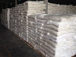 Bags of sugar stacked in stock